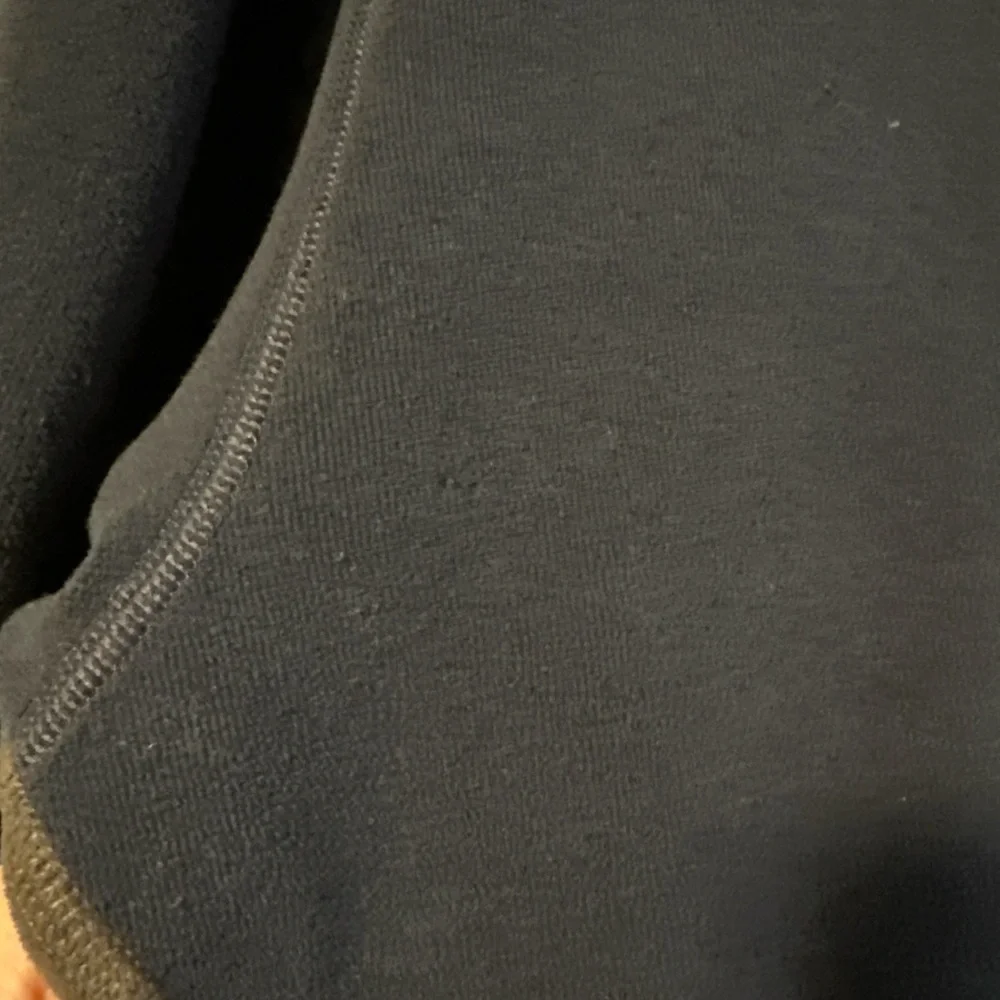 The North Face Navy Blue Fleece with Teal Accent Pocket and Dark Gray Side Panel